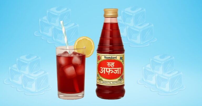 Chilled glass of Rooh Afza with ice cubes, lemon slice, and straw beside a classic Rooh Afza bottle – a refreshing summer drink from India.